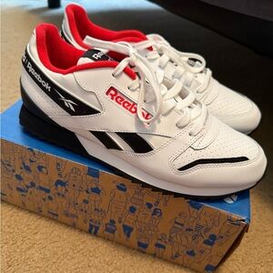 Reebok Classic White and Black Sneakers with Red Accents